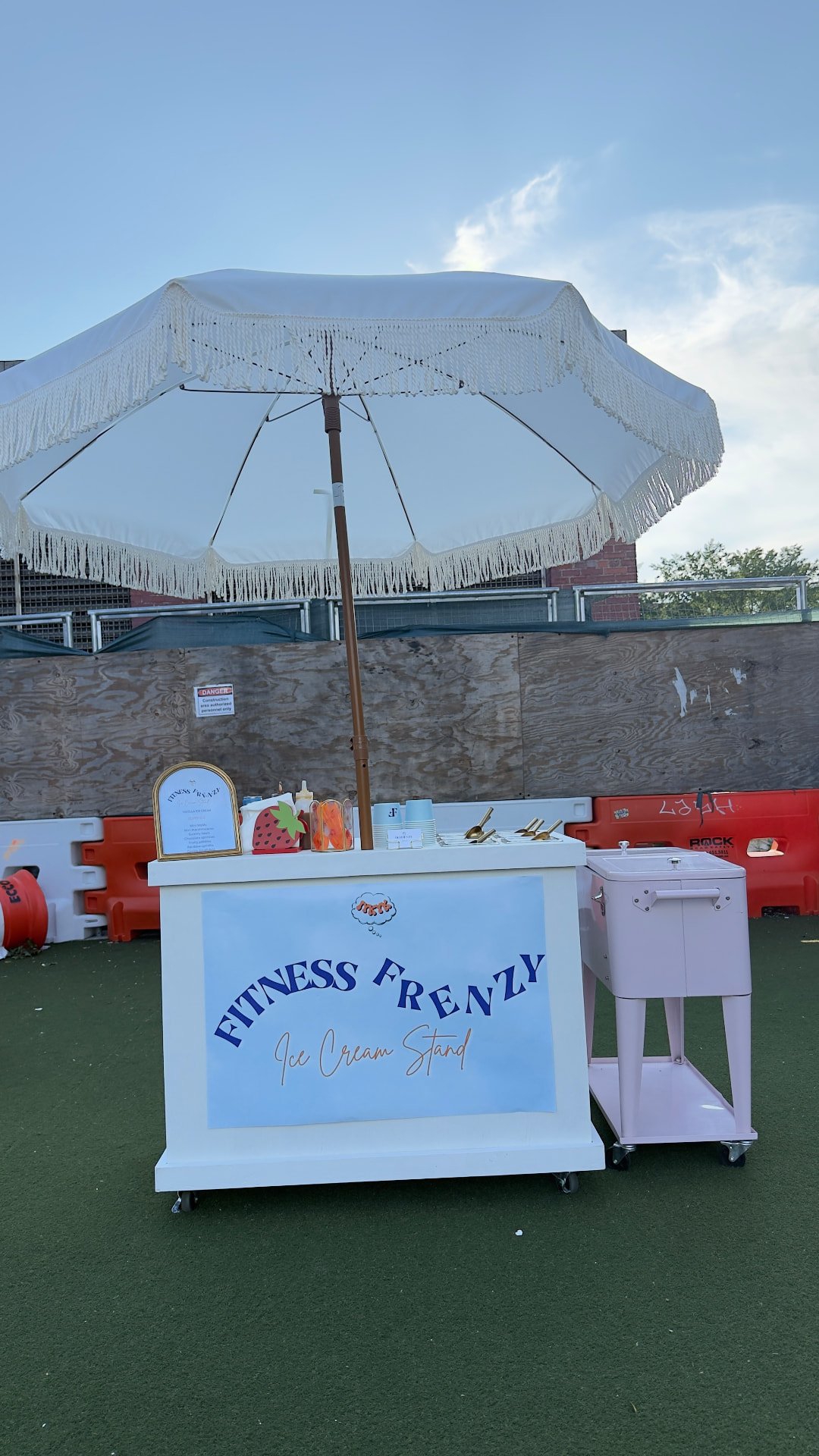 Branded Fitness Frenzy ice cream stand with fringed umbrella