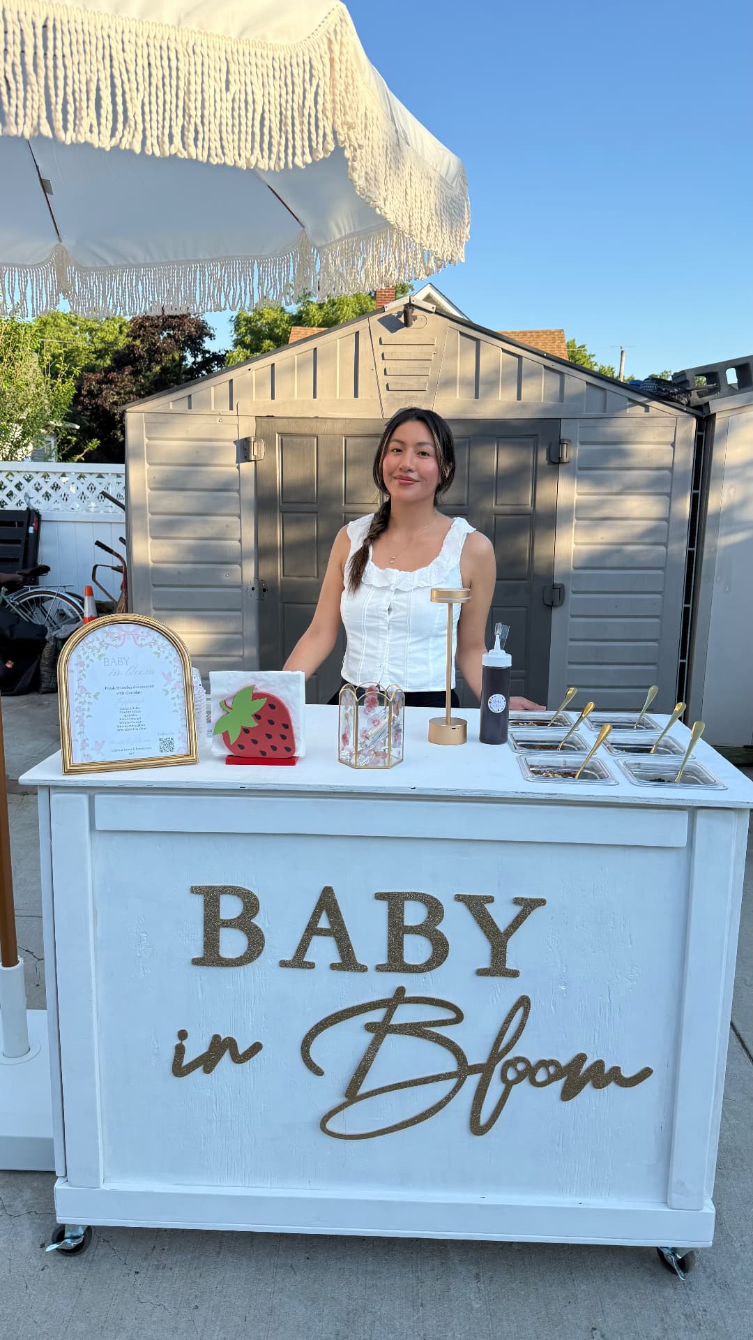 Johanna serving behind a Baby in Bloom dessert cart