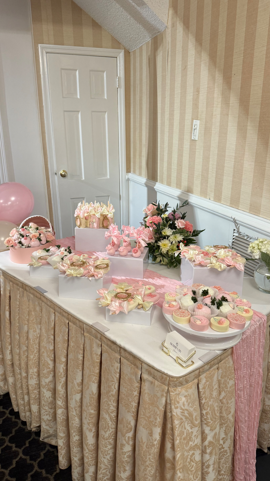 Full dessert table with chocolate covered strawberries, cakesicles and custom treats